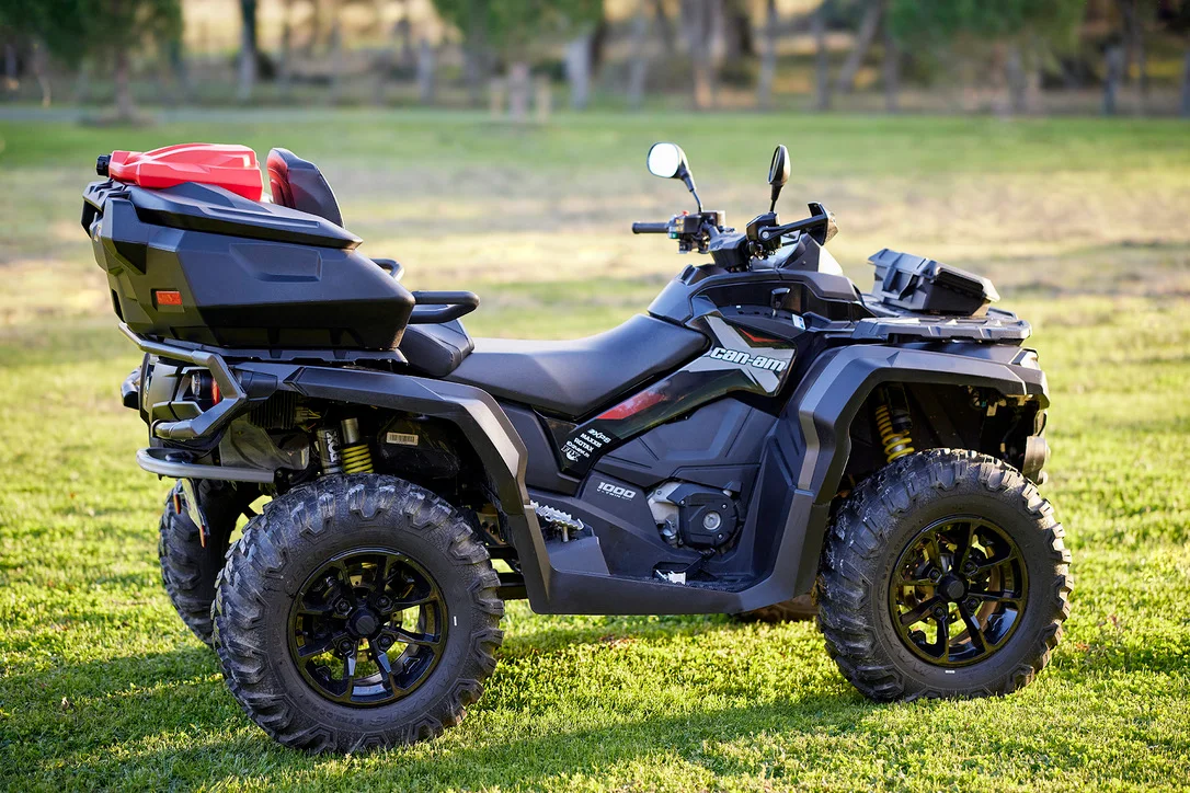 Can-Am ATV fitted with a rear cargo box and red fuel can